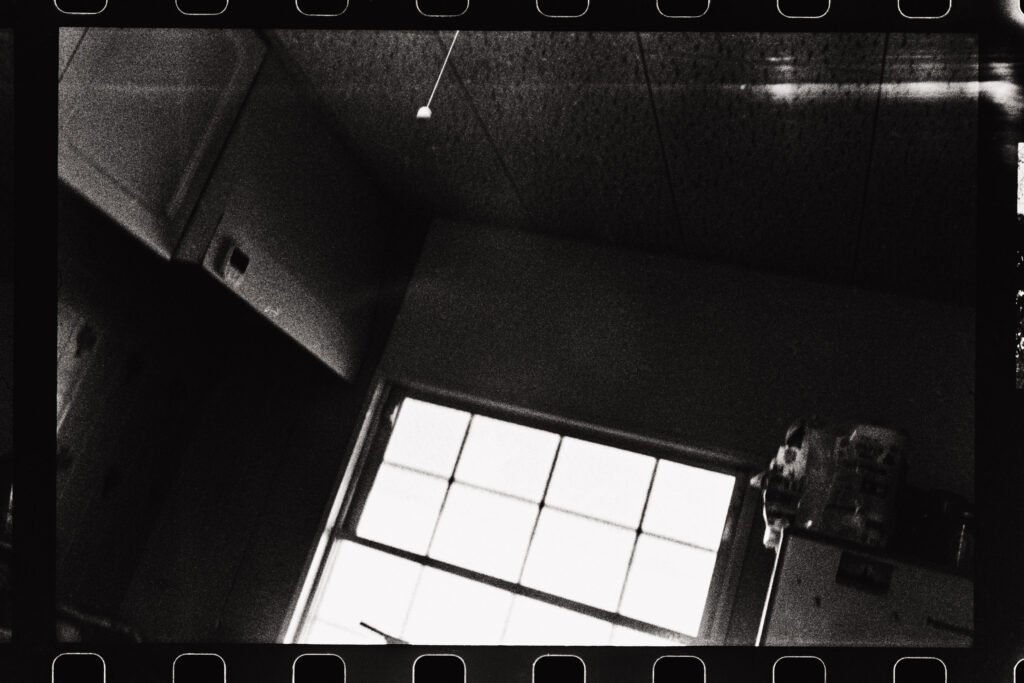 An accidental shot of my kitchen, taken when loading a new roll of film. In it, you can see the ventilation hood above the stove, the window, and part of the refrigerator
