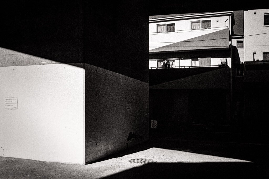 Shadowed urban scene with contrasting light